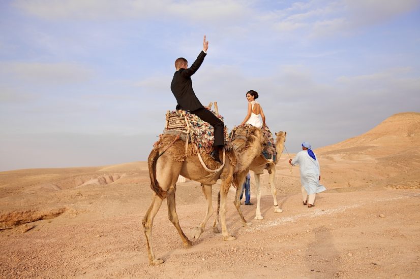 wedding in Marrakech La Pause camel ride ©lasdecoeur